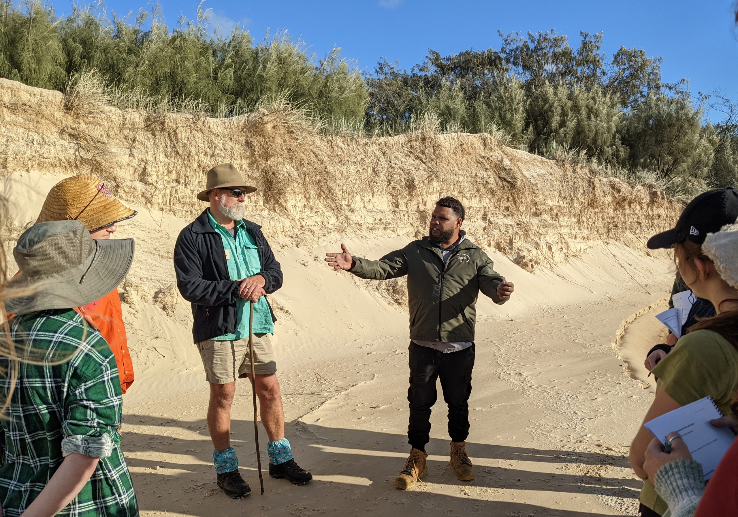 Group standing outside at the mouth of the creek.