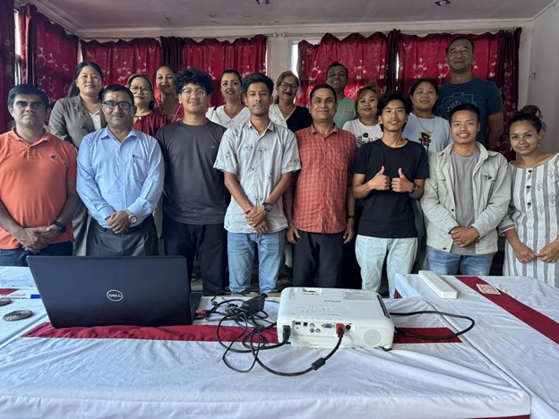 Pushpa (Bottom Right) along with other trainers and community members, smiling for a photo after completing a Tour Guide and Leader Training, where Nabin was one of the participants.