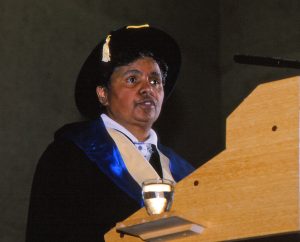 Margaret Valadian AO in a graduation hat and gown at the podium